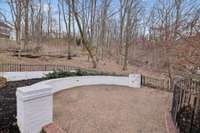 Backyard provides exceptional privacy spring, summer, and fall as you can see by the ample amount of trees.. and the trees also graciously shade the outdoor living space.  Seller originally planned a pool for this space (great place for it!)