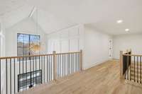 Loft offers a closer look at stunning foyer light fixture and wood trim detailing
