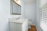 The half bath features a sleek single vanity, a bright single window, and is finished with crown molding.6728 Jim Cummings Hwy Bradyville, TN 37026