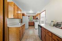 Complemented by extensive counterspace and durable tile floors, this kitchen is designed for both functionality and style. 6728 Jim Cummings Hwy Bradyville, TN 37026