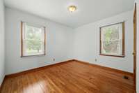 Bedroom 2 features hardwood floors and is illuminated by two generous windows. 6728 Jim Cummings Hwy Bradyville, TN 37026