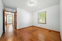 Bedroom 3 offers the warmth of hardwood floors and natural light from a single window. 6728 Jim Cummings Hwy Bradyville, TN 37026