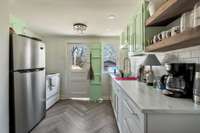 Enjoy cooking in your updated kitchen at the back of the house
