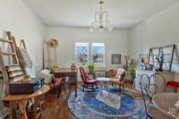 Enter to this sunny living room with soaring ceilings and huge front yard between your window and Riverside Dr. You will fall in love with the original wood floors!