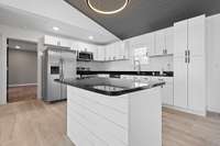 The freestanding island offers additional prep and gathering space.