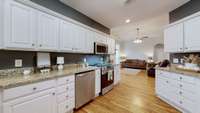 Plenty of storage and countop space here!  Beautiful granite and stainless steel appliances make the kitchen pop!
