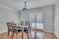 Dining Area with access to the covered back patio/balcony.