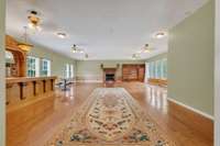 attached rec room/apartment/General Store main living area with new roof, featuring 3rd gas fireplace and solid wood bar