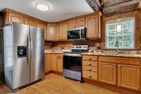 Original log cabin built in 1832 - kitchen with all new appliances