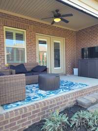 Cozy, covered and screened back patio