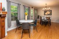 DINING / GAME AREA WITH TWO TABLES AND ENTRANCE TO THE DECK