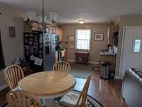 Open concept kitchen, dining and living room
