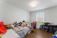 Bedroom 2 with hardwood floors