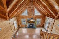 The overlook from the bonus room offers a stunning view, showcasing the large windows that bring in natural light and the slanted ceilings.  4485 Coconut Ridge Smithville, TN 36166