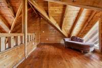 Beautiful triangular windows flood the room with natural light, highlighting the slanted ceilings and adding a touch of character. 4485 Coconut Ridge Smithville, TN 36166