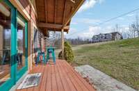 This adorable front porch is covered, offering a cozy space to relax outdoors. It has ample room for furniture, making it a perfect spot for sitting and enjoying the surroundings. 4485 Coconut Ridge Smithville, TN 36166