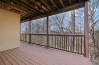 The wooden deck wraps around the back half of the house, offering plenty of space for outdoor relaxation.  4485 Coconut Ridge Smithville, TN 36166