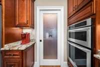 Walk in panty w/ frosted glass pocket door