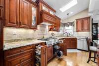 Custom kitchen cabinets w/ spice racks, pan racks, under cabinet lighting & inside cabinet lights.