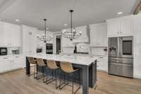 This spacious kitchen is a culinary delight featuring a Gas Cook-top and Double Oven and luxurious quartz countertops