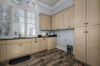 More cabinets and great built-in cleaning closet that houses the Central Vac System components, as well.