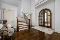 Another view of the Formal Entry/Gathering Room and gorgeous solid wood and glass arched doors