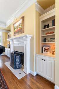 Gas fireplace with built in shelves and cabinets