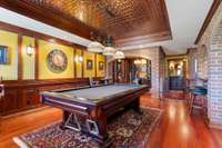 Pool table conveys with home, along with cue storage and cues.