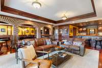 Basement with high-end woodwork and brick finishes