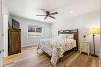 Primary Suite offers a view of the countryside, walk-in closet, a full bath with double vanities, granite counter tops, custom shower and beautiful cabinets.