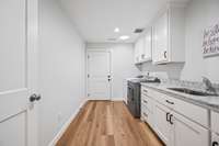 Mud and Laundry room. Easy access from the house or from the garage