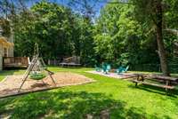 Playground + a firepit with seating area, you have a backyard ready for entertaining!