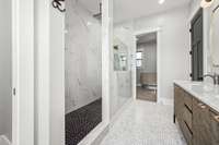 Spa-like luxury! The owner's ensuite features a stunning freestanding tub, dual vanities, and a walk-in shower with exquisite Italian tile. Thoughtfully designed for relaxation, this space offers the perfect retreat.