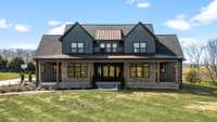 This stunning modern farmhouse blends luxury and charm on scenic acreage. With high-end finishes, an expansive porch, and breathtaking views, it offers elegance and comfort in a private setting. A rare opportunity for refined country living!