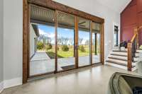 Seamless indoor-outdoor living! Expansive sliding doors open to a spacious backyard, perfect for entertaining or adding a custom pool. Enjoy breathtaking views and endless possibilities in this serene retreat.