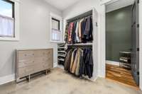 This large walk-in closet offers custom built-ins, ample storage, and natural light. Conveniently located adjacent to the private sauna room, it’s the perfect blend of luxury and functionality.