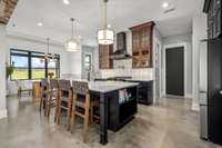 A chef’s dream! This stunning kitchen features two ovens, custom cabinetry, elegant lighting, and a spacious island. Designed for both function and style, it’s perfect for entertaining and creating culinary masterpieces.