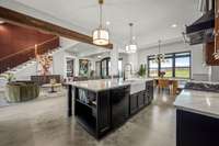 An entertainer’s dream! This open-concept design seamlessly connects the chef’s kitchen, formal dining, living room, and a cozy reading nook. Perfect for hosting or everyday luxury living, with stunning views and high-end finishes throughout.