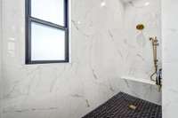 Spa-like luxury! The owner's ensuite features a stunning freestanding tub, dual vanities, and a walk-in shower with exquisite Italian tile. Thoughtfully designed for relaxation, this space offers the perfect retreat.