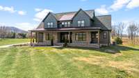 This stunning modern farmhouse blends luxury and charm on scenic acreage. With high-end finishes, an expansive porch, and breathtaking views, it offers elegance and comfort in a private setting. A rare opportunity for refined country living!