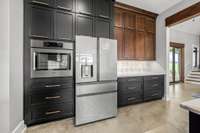 Sleek & functional! This kitchen boasts custom two-tone cabinetry, high-end appliances, and ample storage. Thoughtfully designed with style and efficiency in mind, it’s the perfect blend of modern luxury and everyday convenience.