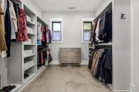 This large walk-in closet offers custom built-ins, ample storage, and natural light. Conveniently located adjacent to the private sauna room, it’s the perfect blend of luxury and functionality.