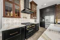 Cook like a pro! This chef’s kitchen features a high-end ZLINE gas range, custom cabinetry, and elegant finishes. Designed for both function and style, it’s the perfect space to create gourmet meals with ease.