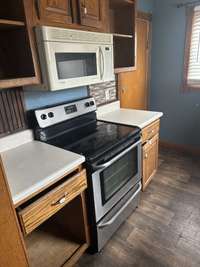 Kitchen includes Stove, Microwave & lots of Cabinet Space.