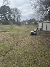 Big Fenced in Backyard with a Tool Shed.