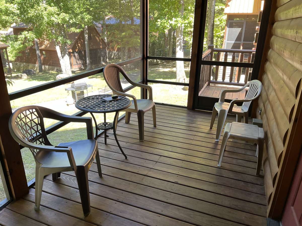 Screened deck, off the downstairs Master Bedroom. Access also from side deck.