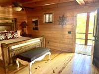 Downtairs Master with private door to screened in deck and Hot Tub.