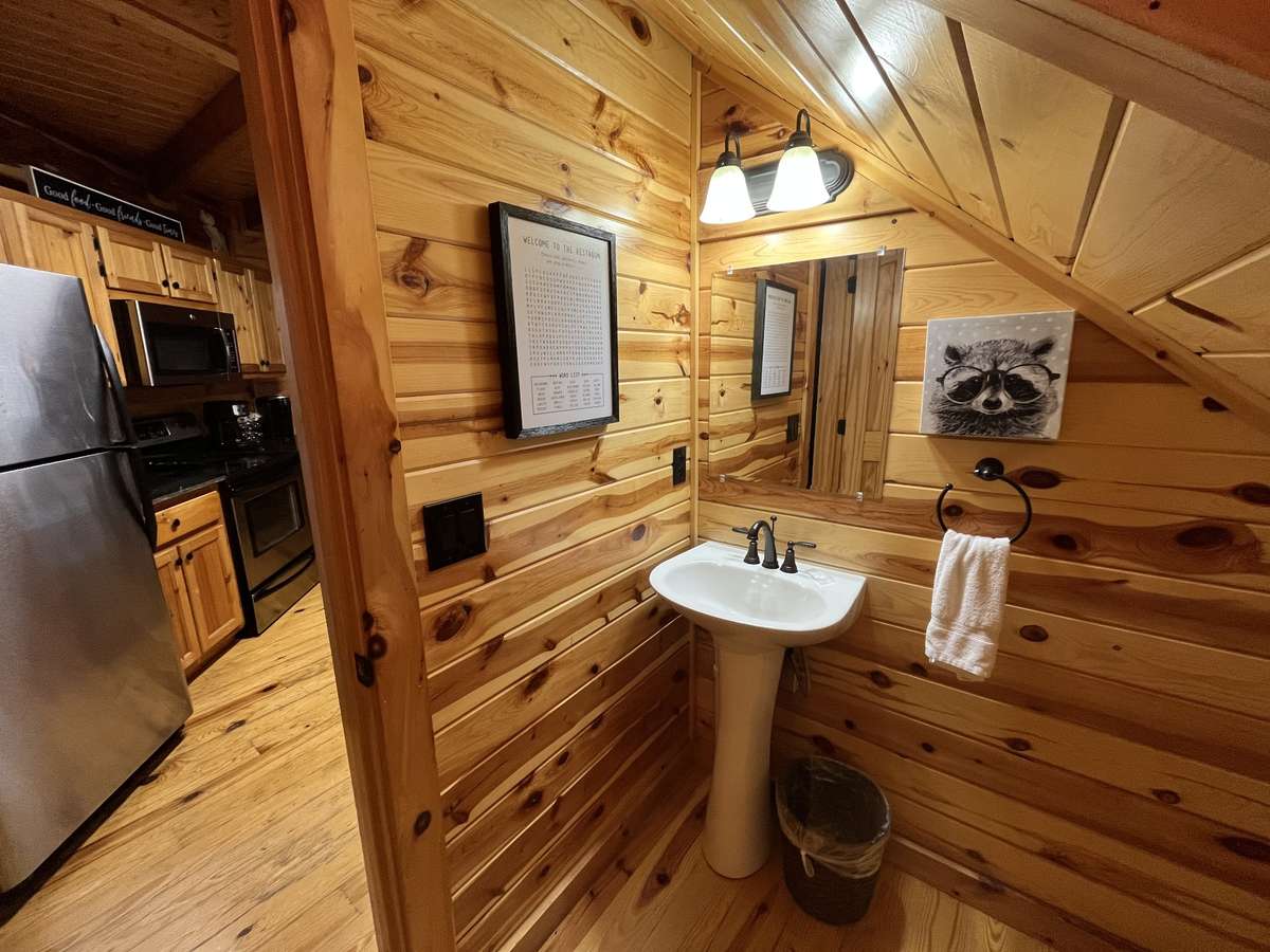 Rare to have a 1/2 bath downstairs.  This allows for the Master ensuite bathroom to remain private.