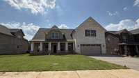 NEW All BRICK, 4 bedroom 3.5 bath, 2 car insulated garage, Huge covered/screened back porch with wood burning fireplace, large outside patio, Gourmet kitchen, quartz, appliance pkg, laminate, tile, craftsman trim, oak stair tread, blinds! Ready July