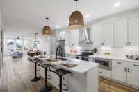 Perfectly planned kitchen with stainless steel appliances makes meal prep enjoyable and easy.